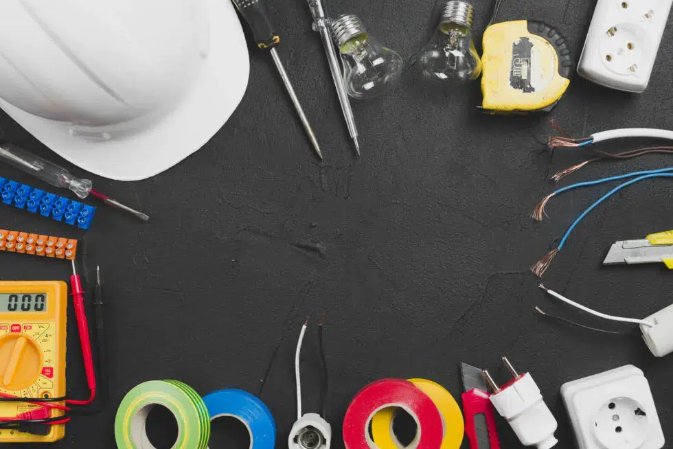 assortment of electrical tools and a hard hat
