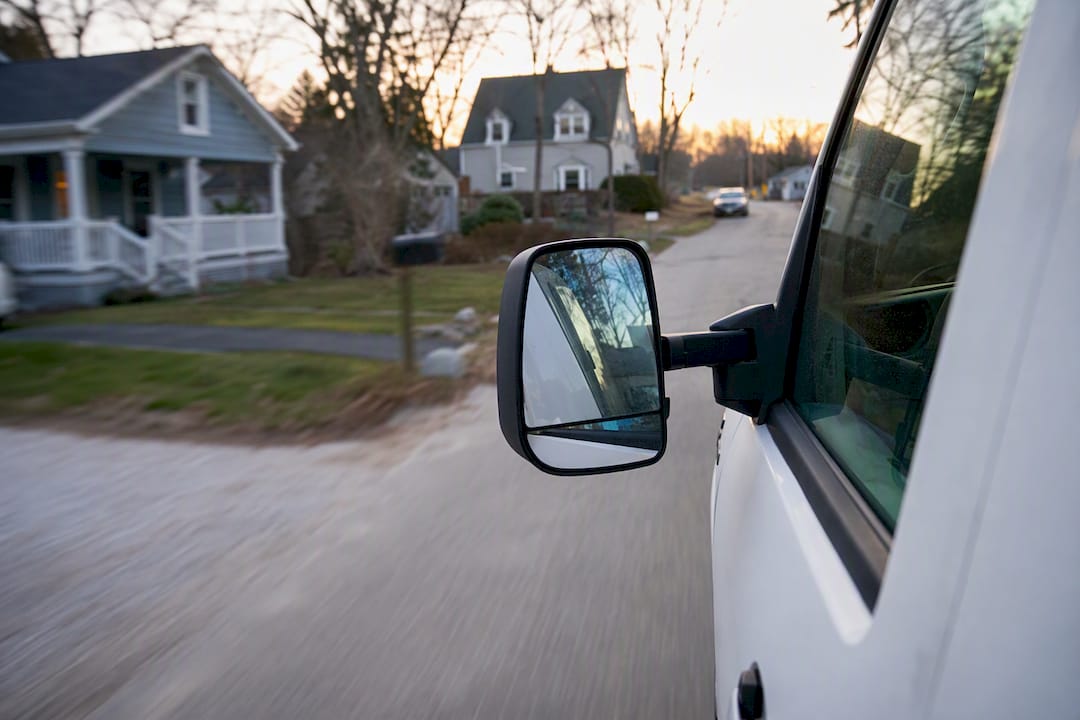 Service truck driving in neighborhood